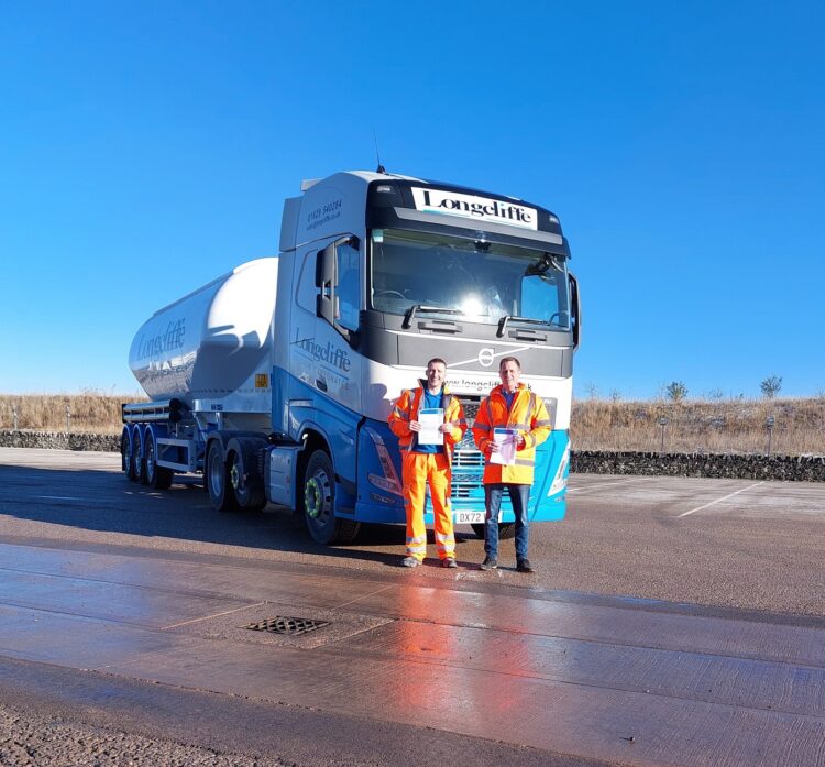 Longcliffe’s Logistics Manager James Hopkinson (right) celebrates the FORS Silver accreditation with driver Liam Fletcher