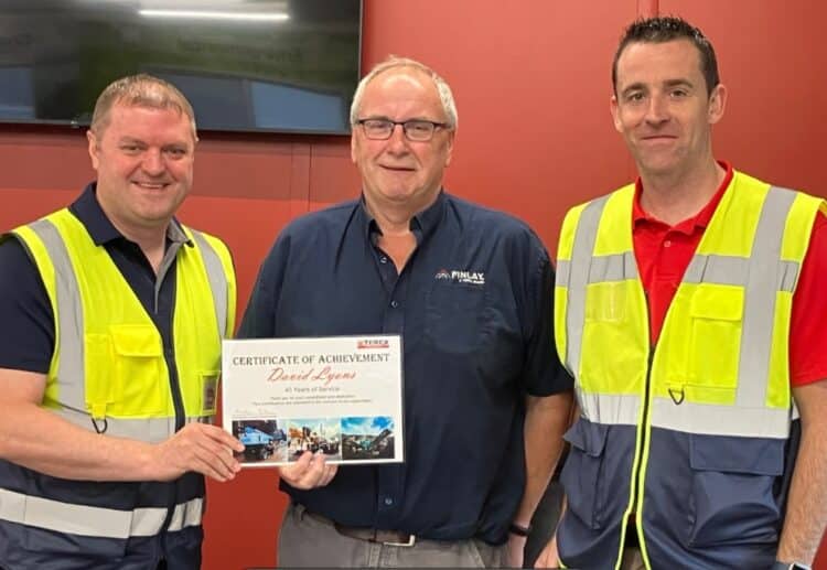 David Lyons receiving his 45 years of service award from Matt Dickson, GM of Terex Omagh (left) and Kieran McCrossan, Operations Director (right). Image/Finlay