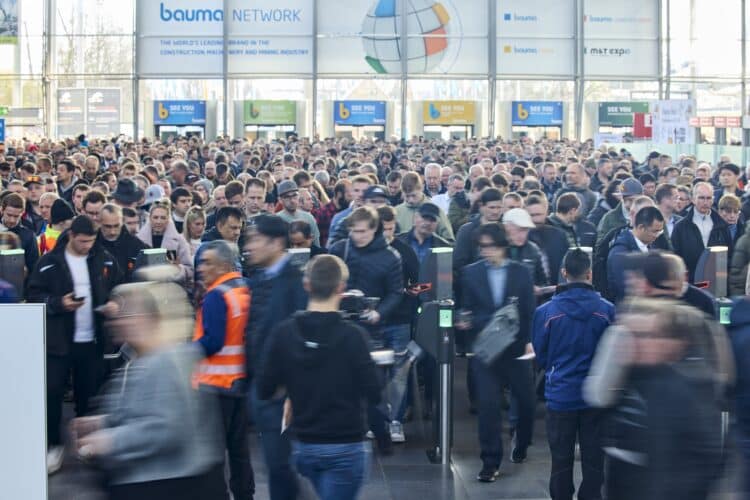 bauma Munich 2025 attendees entering the show from Eingang Ost. Image/Messe München