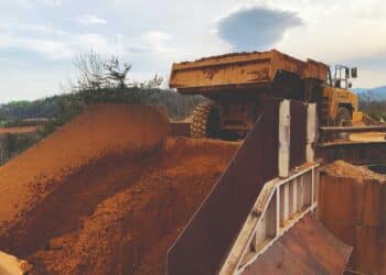 Without flow aids, accumulation of material is common throughout cement manufacturing, from quarry to load-out of the finished product. Image: Martin Engineering